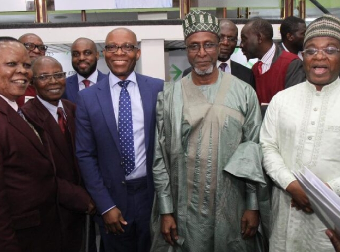 Gregory Jobome, Executive Director, Risk Management, Access Bank Plc in conversation with Balarabe Abbas Lawal, Minister of Environment at the launch of the NGX Impact Board at the Nigerian Exchange... recently.